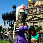 Mexicans posing with the arty skeletons.